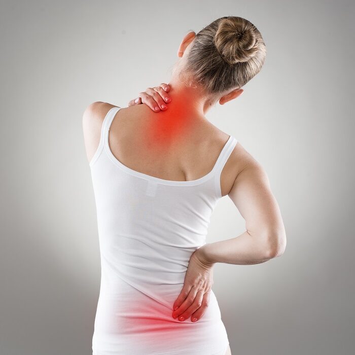 Woman experiencing neck and back pain